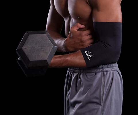 A man holding a dumbbell equipped with an elbow sleeve