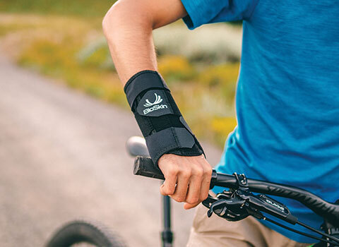Close-up of a cyclist with a wrist brace