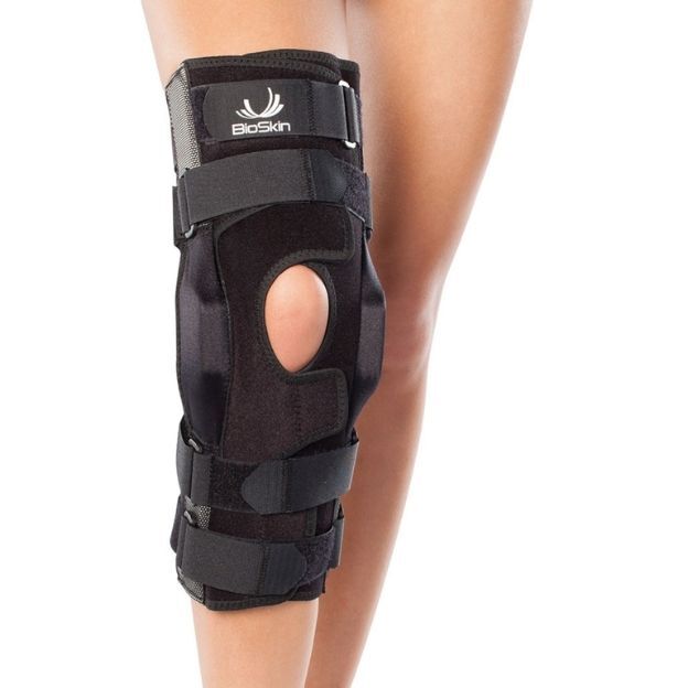 BioSkin knee brace with side hinges, open kneecap window, and multiple straps for secure, full-leg support.