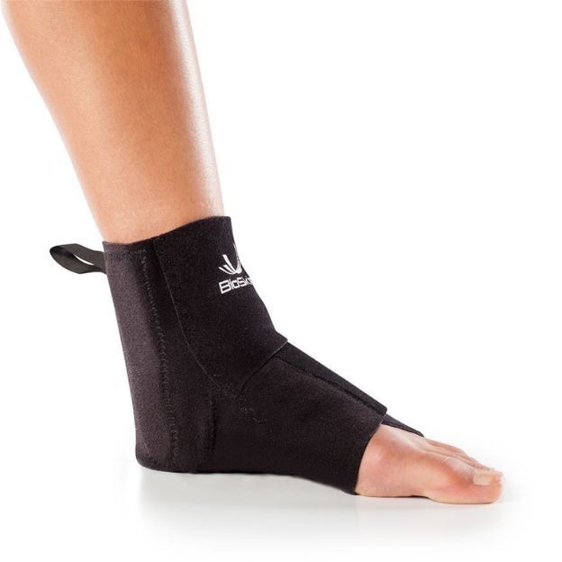 TriLok™ stabilizing brace with straps around the arch and ankle, worn over a white sock.