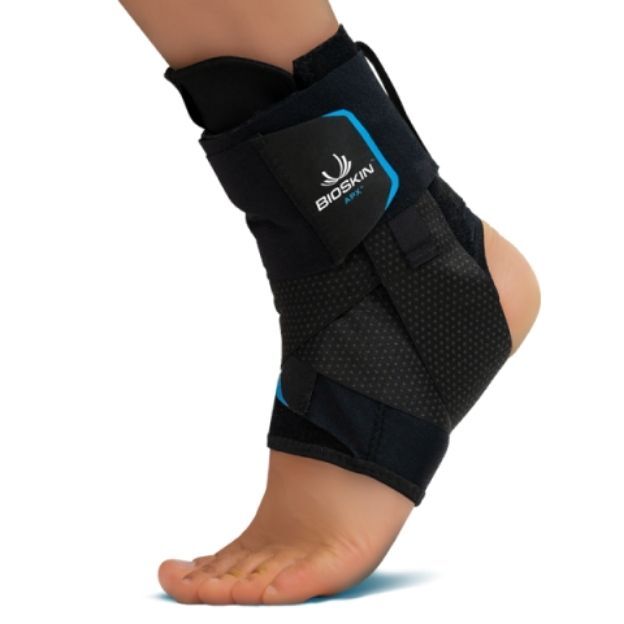 APX ankle brace with blue accents worn on a foot for support and stability.