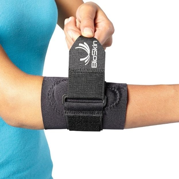 BioSkin tennis elbow band with adjustable strap worn on a person&rsquo;s forearm.