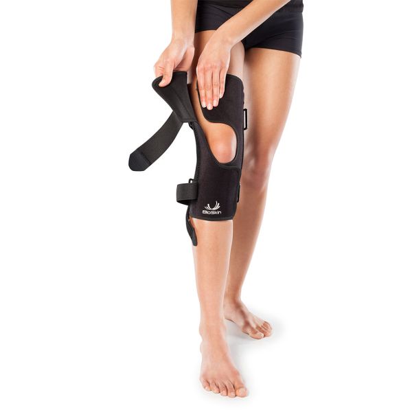 Adjustable fit patella tracking knee brace